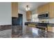Well-equipped kitchen with stainless steel appliances, stone countertops, and ample cabinet space at 337 Shore E Dr, Oldsmar, FL 34677