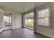 Enclosed sun room featuring large windows and access to the outdoors at 337 Shore E Dr, Oldsmar, FL 34677