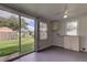 Bright sun room with sliding glass doors opening to the backyard at 337 Shore E Dr, Oldsmar, FL 34677