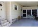 Spacious carport area with tiled flooring and ample seating, perfect for relaxing and enjoying the outdoor space at 369 Cobia Way, Oldsmar, FL 34677