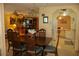 Open-concept dining room that flows into a retro kitchen and living room with lots of sunlight at 369 Cobia Way, Oldsmar, FL 34677