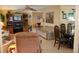 Spacious living area with a ceiling fan, comfortable seating, and dining area, offering a versatile and inviting living space at 369 Cobia Way, Oldsmar, FL 34677