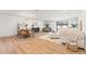 Bright and airy living room featuring a dining area, white walls, and modern furnishings at 398 Walnut Ct, Palm Harbor, FL 34683