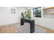 Modern home office with a sleek black desk, stylish decor and natural light at 398 Walnut Ct, Palm Harbor, FL 34683