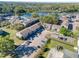 Aerial view of condos with parking and a pond in the background at 4004 Cortez Dr # D, Tampa, FL 33614