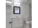 Bathroom features a vanity with storage, toilet, and tub with updated tile at 4004 Cortez Dr # D, Tampa, FL 33614