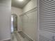 Spacious walk-in closet features ample storage with a wire shelf and stylish wood-look floors at 4004 Cortez Dr # D, Tampa, FL 33614
