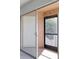 View of patio with neutral colored flooring and black framed door with screen at 4004 Cortez Dr # D, Tampa, FL 33614