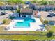 Aerial view of a large pool and clubhouse surrounded by condos and parking at 4004 Cortez Dr # D, Tampa, FL 33614