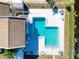 Aerial view of community pool, showing its shape and surrounding lounge area at 4004 Cortez Dr # D, Tampa, FL 33614