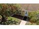 Aerial view of a charming home with lush landscaping and a welcoming entrance at 401 Dorchester Pl # 55, Sun City Center, FL 33573