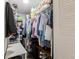 Walk-in closet with metal shelving, hanging rods, storage and organization for clothes, and personal items at 401 Dorchester Pl # 55, Sun City Center, FL 33573