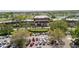 Community center featuring ample parking, palm trees, and meticulously landscaped grounds and a U.S. flag at 401 Dorchester Pl # 55, Sun City Center, FL 33573