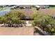 Charming single-story home featuring a well-maintained lawn, pathway, and mature, flowering trees at 401 Dorchester Pl # 55, Sun City Center, FL 33573