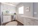 Modern kitchen featuring white cabinets, stainless steel appliances, and sleek countertops at 401 Dorchester Pl # 55, Sun City Center, FL 33573