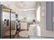 Beautiful kitchen with stainless steel appliances, white cabinets, and modern fixtures at 401 Dorchester Pl # 55, Sun City Center, FL 33573