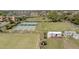 Shuffleboard courts with covered seating and lawn bowling, adjacent to a residential neighborhood at 401 Dorchester Pl # 55, Sun City Center, FL 33573