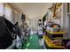 Enclosed storage area with work space to the right and bicycles on the left at 401 Dorchester Pl # 55, Sun City Center, FL 33573