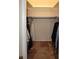 A reach-in closet with hanging rod and beige carpet provides ample storage space at 4338 Tahitian Gardens Cir # H, Holiday, FL 34691