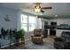 Inviting living area combining seating and dining spaces, accentuated by serene pond views and natural light at 4338 Tahitian Gardens Cir # H, Holiday, FL 34691