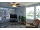 Bright living room offering scenic pond views with neutral paint, a ceiling fan and comfortable seating at 4338 Tahitian Gardens Cir # H, Holiday, FL 34691