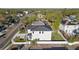 Elevated view of a modern home showcasing a white fence and verdant landscaping at 4405 W Euclid Ave, Tampa, FL 33629