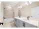 Modern bathroom featuring a double vanity with gray cabinets and sleek black fixtures at 4405 W Euclid Ave, Tampa, FL 33629