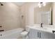 Full bathroom with tub and shower combo, gray vanity, and quarts countertop at 4405 W Euclid Ave, Tampa, FL 33629