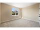 Bedroom with neutral color scheme and a large window providing natural light at 4405 W Euclid Ave, Tampa, FL 33629