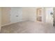 Bedroom featuring a closet, ensuite bathroom and neutral carpeted floors at 4405 W Euclid Ave, Tampa, FL 33629