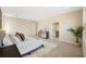 Serene bedroom with soft carpet, neutral decor, and a glimpse into the en-suite bathroom at 4405 W Euclid Ave, Tampa, FL 33629