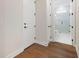 Hallway view leading to a bathroom with a glass enclosed shower at 4405 W Euclid Ave, Tampa, FL 33629