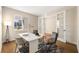 Modern home office with sleek desk, comfortable seating, and glass paneled door for privacy at 4405 W Euclid Ave, Tampa, FL 33629