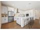 Modern kitchen featuring white cabinetry, stainless steel appliances, and a large central island at 4405 W Euclid Ave, Tampa, FL 33629