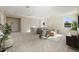 Bright living room features plush carpeting, contemporary furniture, and natural light through multiple windows at 4405 W Euclid Ave, Tampa, FL 33629