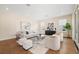 Spacious living room with hardwood floors, modern furnishings, neutral tones, and ample natural light at 4405 W Euclid Ave, Tampa, FL 33629