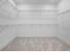 Spacious walk-in closet with ample shelving for organized storage at 4405 W Euclid Ave, Tampa, FL 33629