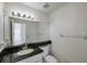 Bathroom with granite counters, a big mirror, and good lighting above sink at 5014 Sterling Manor Dr, Tampa, FL 33647