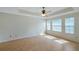 Bright bedroom with a tray ceiling, ceiling fan, and a lot of natural light at 5014 Sterling Manor Dr, Tampa, FL 33647