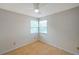 Bedroom with wood floors and two windows at 5014 Sterling Manor Dr, Tampa, FL 33647