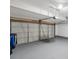 A spacious garage with painted floor and storage for organization and parking at 5014 Sterling Manor Dr, Tampa, FL 33647