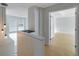 Hallway with wooden floors leads to the bedrooms upstairs at 5014 Sterling Manor Dr, Tampa, FL 33647