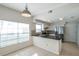 Eat in kitchen boasts granite countertops, stainless steel appliances and ample cabinet space at 5014 Sterling Manor Dr, Tampa, FL 33647