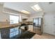 Updated kitchen features granite countertops, stainless steel appliances and modern lighting at 5014 Sterling Manor Dr, Tampa, FL 33647