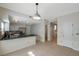 Eat in kitchen boasts granite countertops, stainless steel appliances and ample cabinet space at 5014 Sterling Manor Dr, Tampa, FL 33647