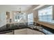 Well-lit kitchen with stainless steel appliances, granite countertops, and a sink with modern fixtures at 5014 Sterling Manor Dr, Tampa, FL 33647
