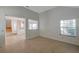 Bright living room with tile floors and natural light offers sightlines to the staircase at 5014 Sterling Manor Dr, Tampa, FL 33647