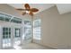 Bright living room featuring French doors and many windows at 5014 Sterling Manor Dr, Tampa, FL 33647