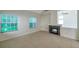 Comfortable living room showcases fireplace and bright windows at 5014 Sterling Manor Dr, Tampa, FL 33647