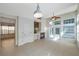 Bright and airy living room with fireplace and fan with access to patio at 5014 Sterling Manor Dr, Tampa, FL 33647
